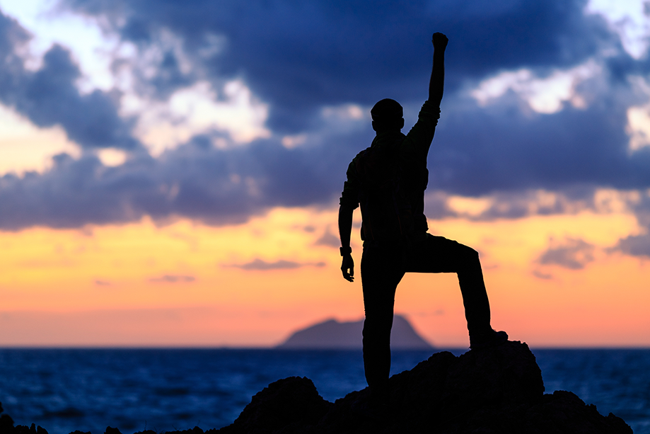 man standing on a rock