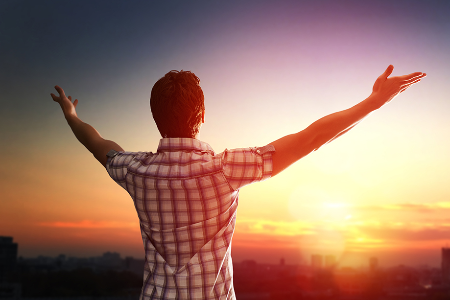 man open arms on sunset