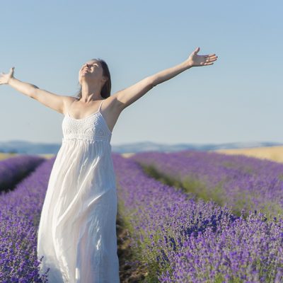 woman open arms at lavender field