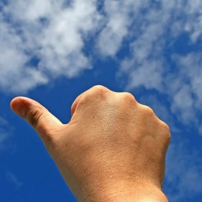 thumbs up on sky