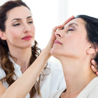woman holding another woman's head