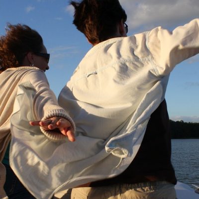 man and woman riding a boat