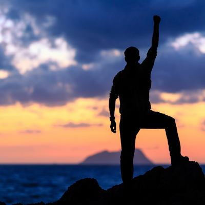 man standing on a rock