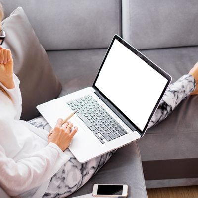 woman sitting down with a computer