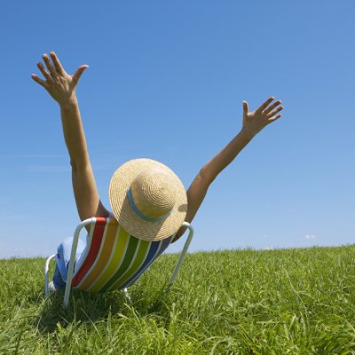 man with open arms at the field