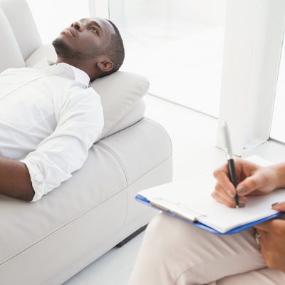 man lying down for hypnotherapy
